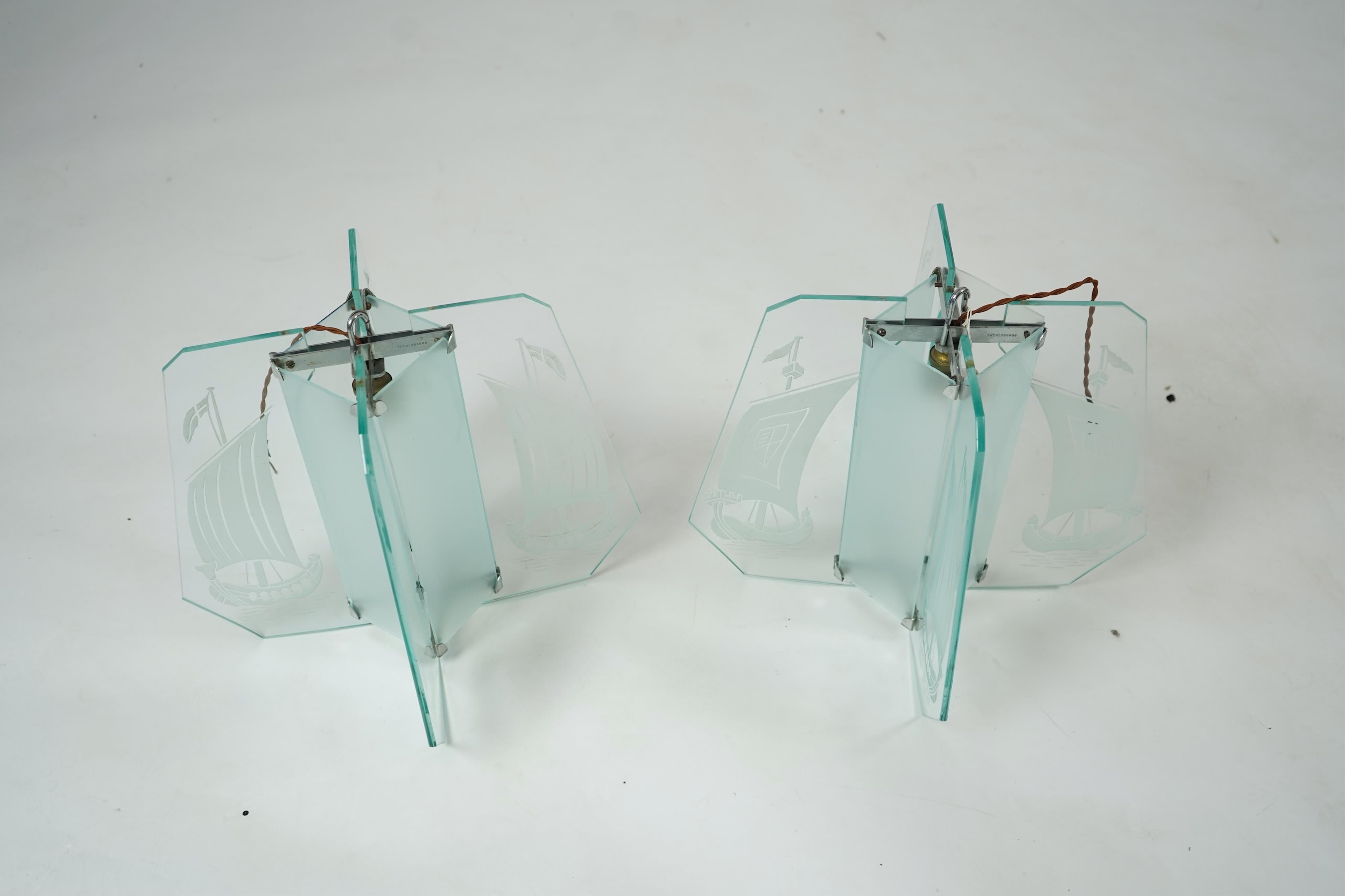 A pair of Art Deco chrome and four panelled etched glass ‘Galleon’ designed celling pendant lights